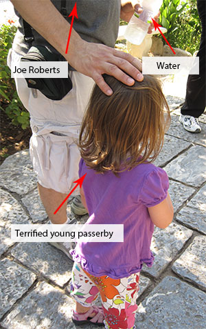 joe_roberts_passerby Joe Roberts hides his water behind a child