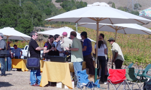 Joe tasting at Kick Ranch on his way around to the Bedrock growlers (far left)